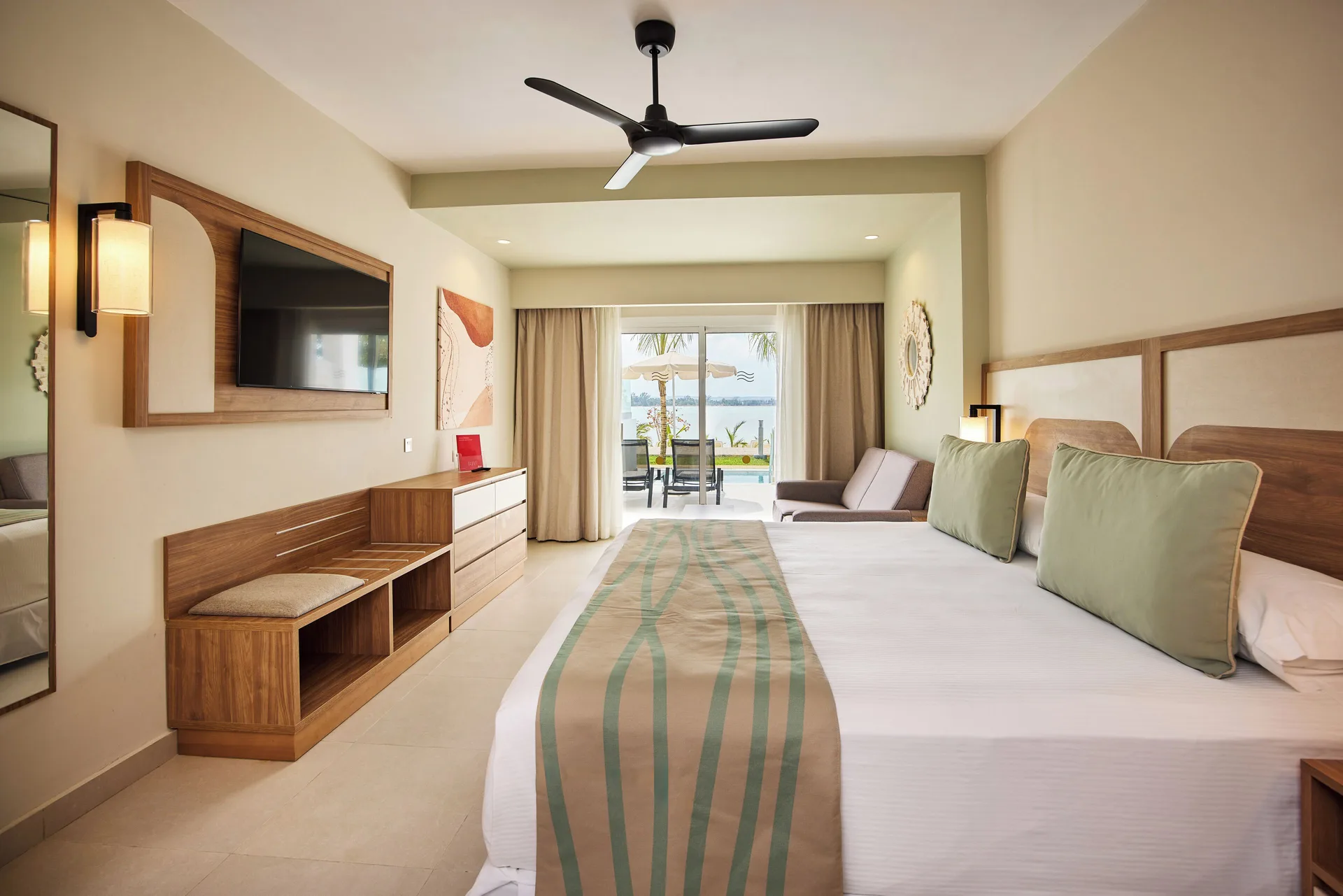 Room Oceanfront Swim-Up bedroom with ocean-facing terrace at Riu Negril.