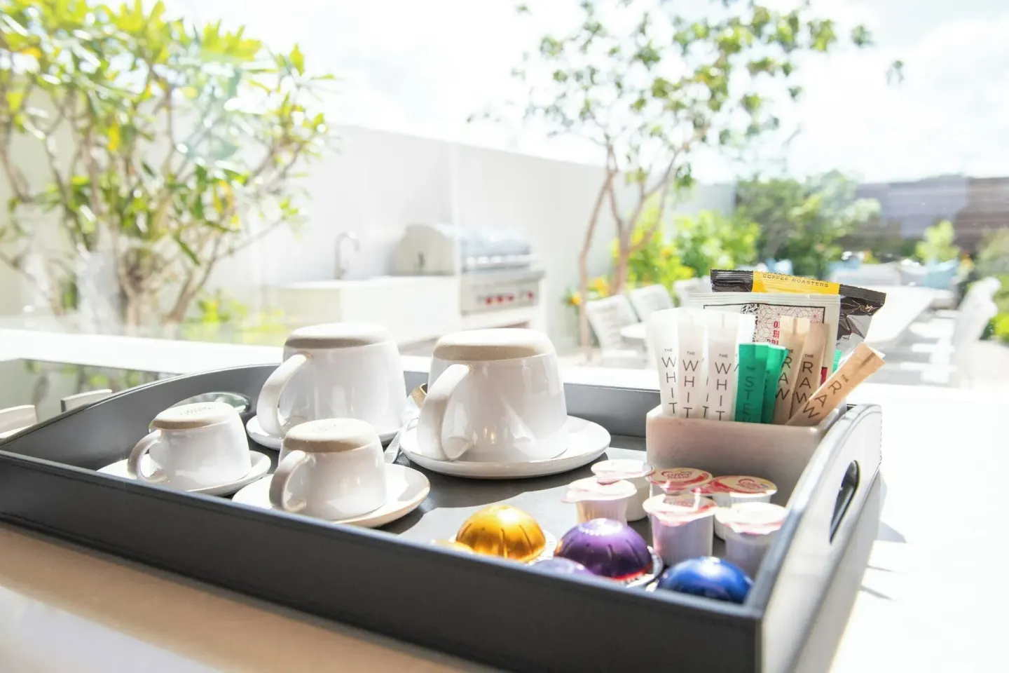 Coffee and tea tray set beside a sunny terrace at Rock House.
