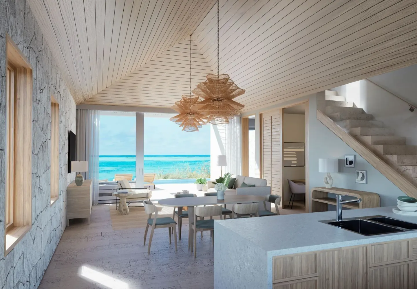 Ocean View Five Bedroom Reserve Villa great room with kitchen, stairs, and ocean view at Rock House.