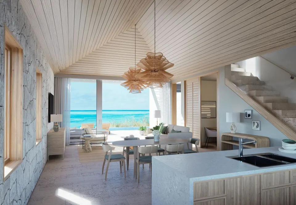 Ocean View Five Bedroom Reserve Villa great room with kitchen, stairs, and ocean view at Rock House.