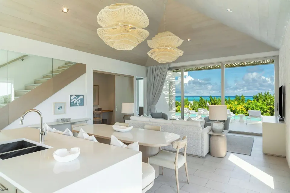 Ocean View Five Bedroom Reserve Villa living area with kitchen and ocean terrace at Rock House.