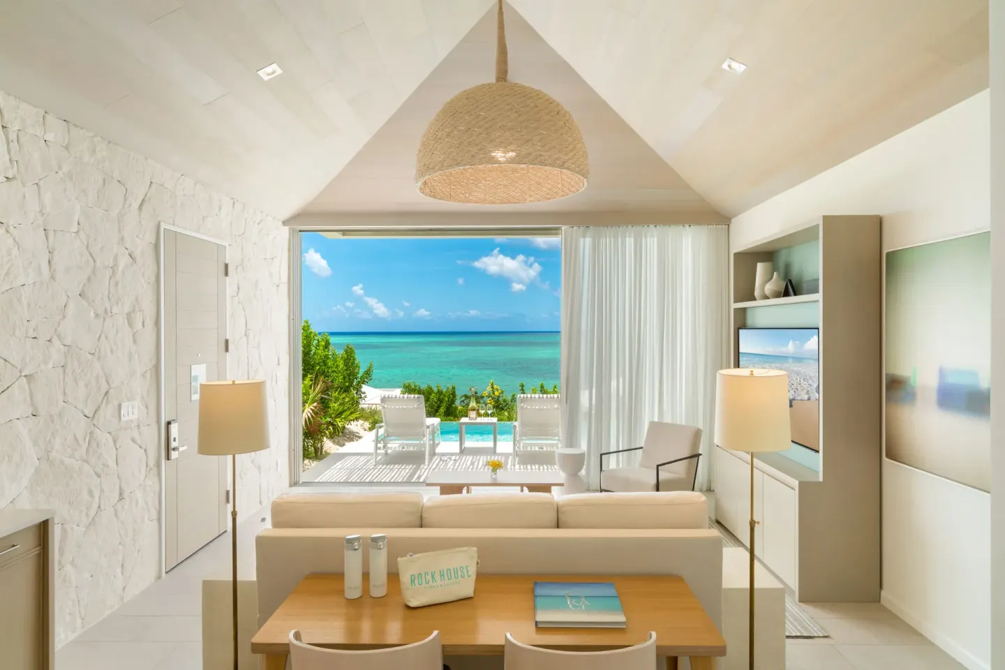 Ocean View Ridge One Bedroom at Rock House with living area, vaulted ceiling, and ocean view.