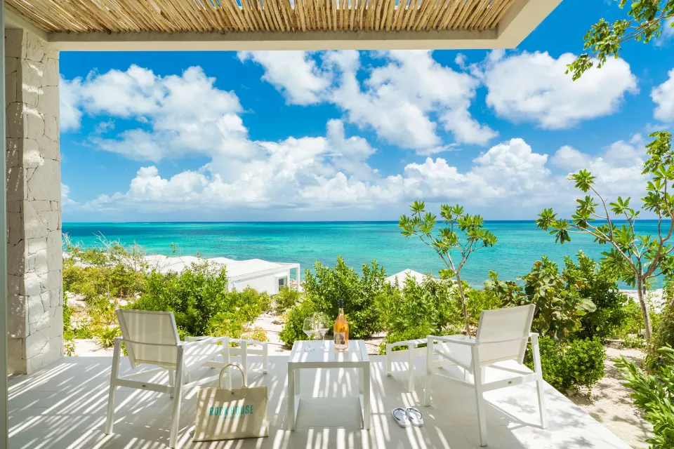 Ocean View Ridge Studio terrace with lounge chairs and ocean view at Rock House.