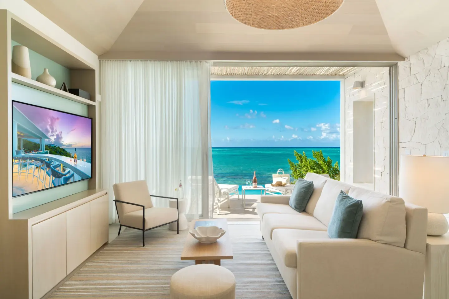 Oceanfront One Bedroom living room with ocean-facing terrace at Rock House.