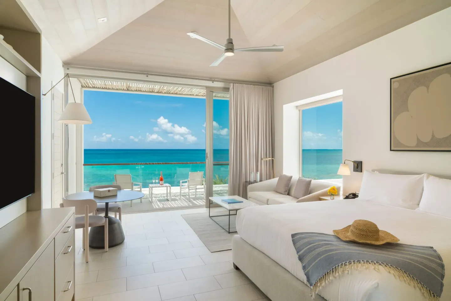Oceanfront Pool View Studio king bed and balcony sea view at Rock House.
