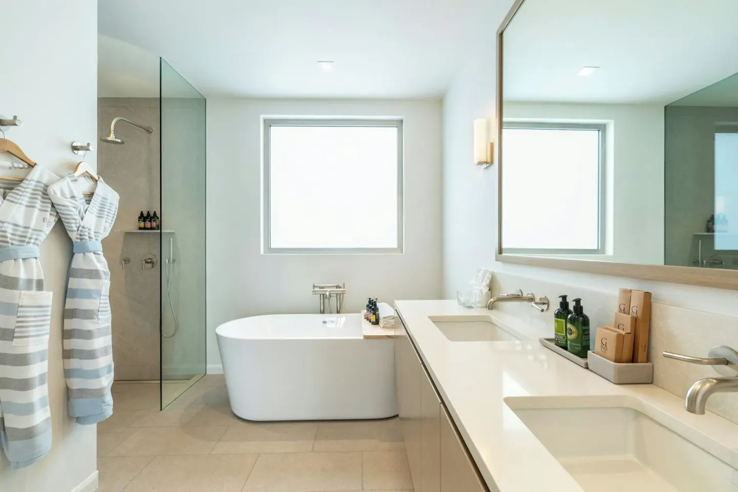 Oceanfront Studio bathroom with freestanding tub and robes at Rock House.