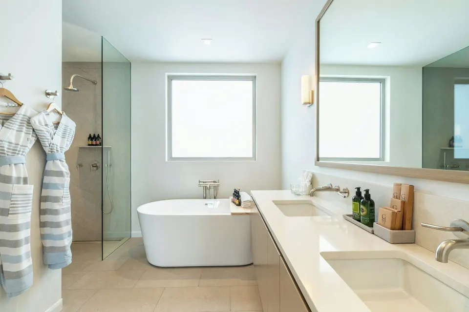 Oceanfront Studio bathroom with freestanding tub and robes at Rock House.