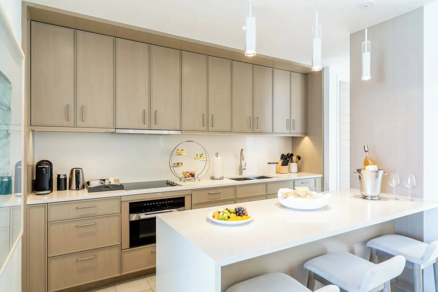 Villa 2-bedroom ocean view kitchen at Rock House with long counter, island seating, and built-in appliances.