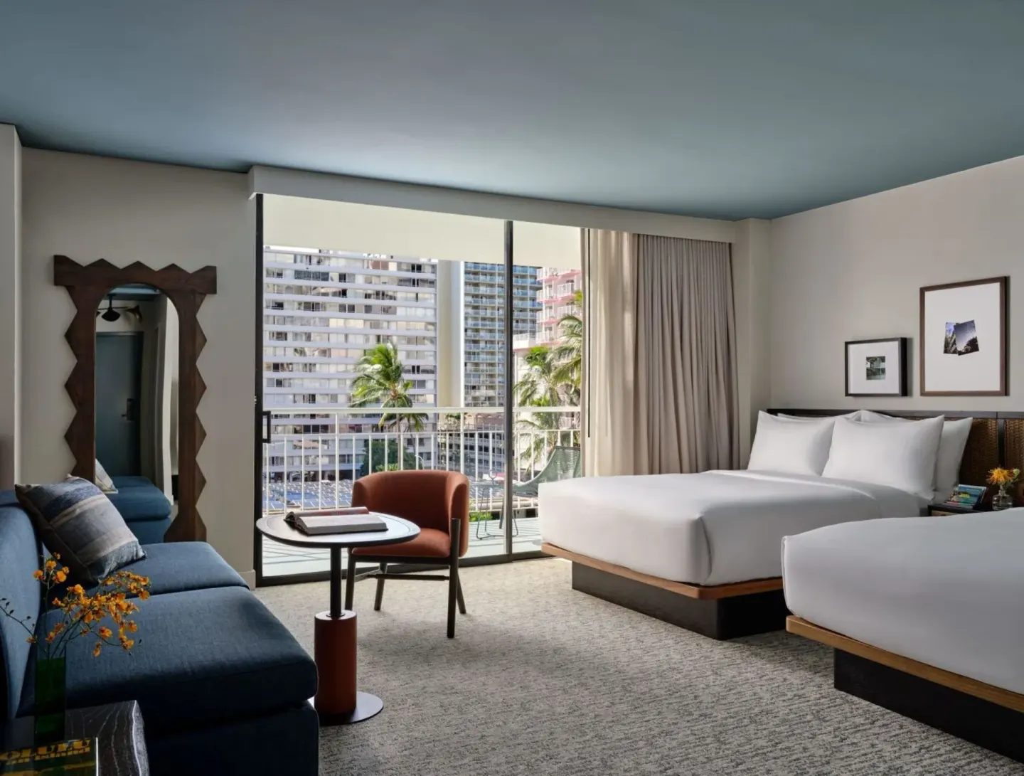 Junior Suite with two queen beds, sofabed, and balcony doors at Romer House Waikiki.
