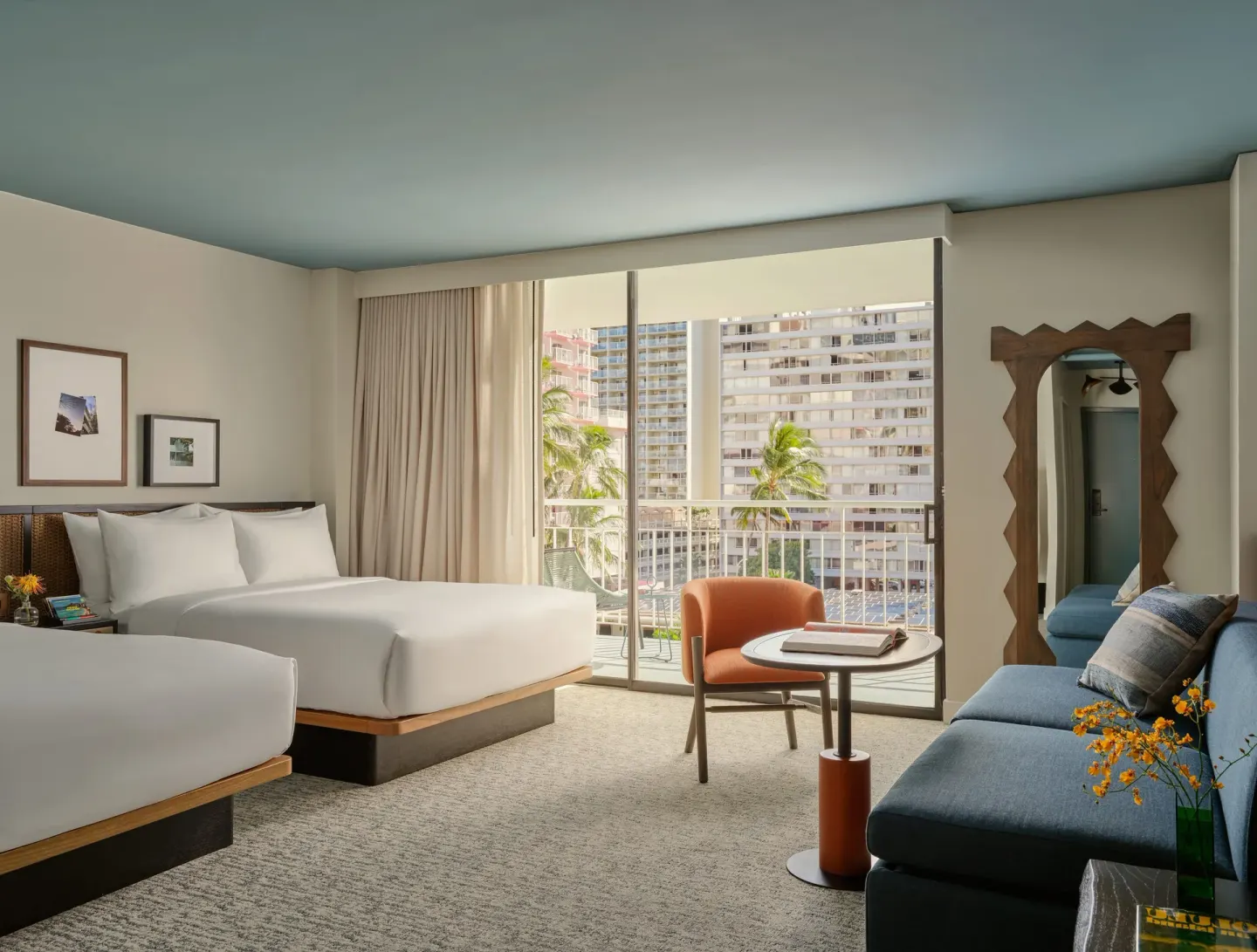 Junior Suite with two queen beds, sofabed, and balcony at Romer House Waikiki.
