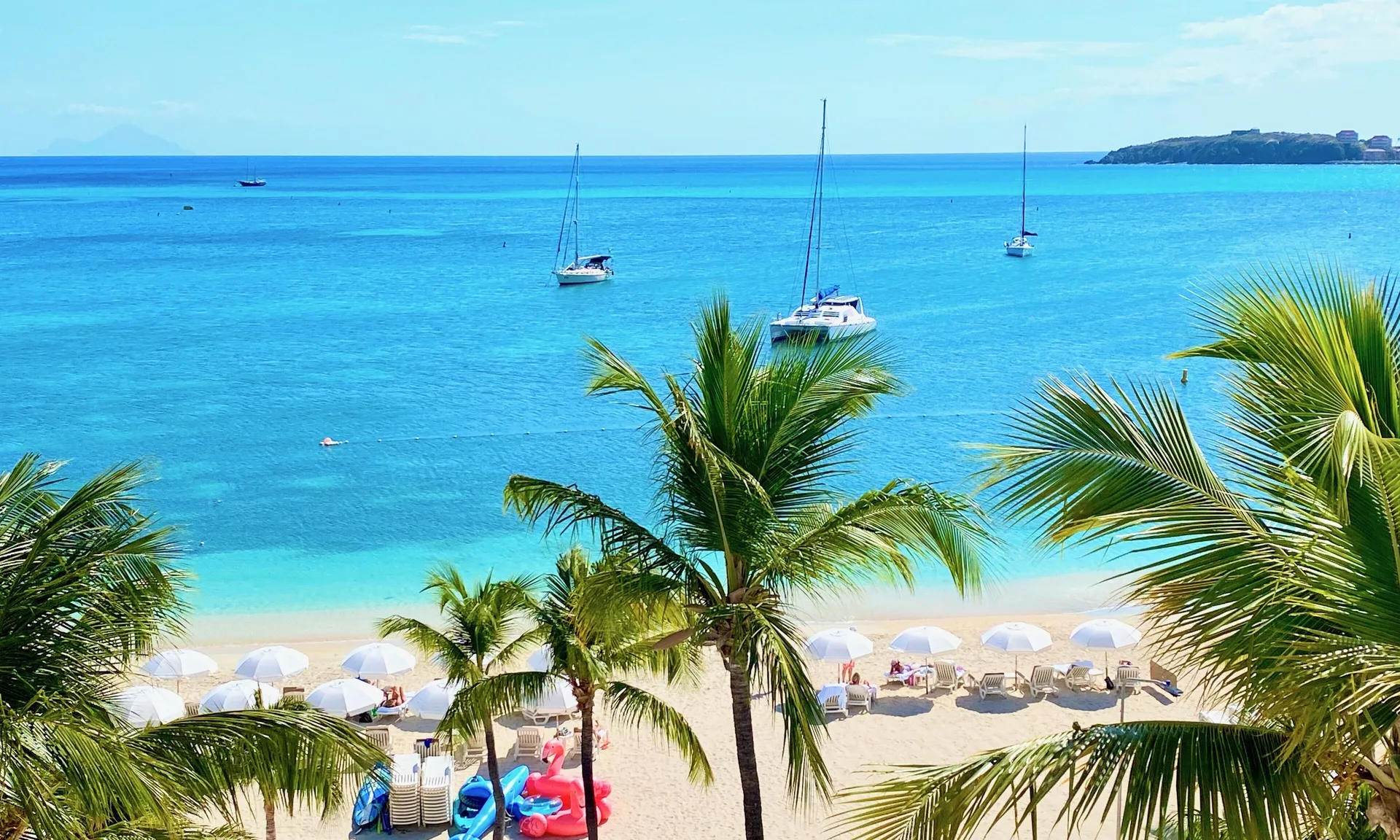 Holland House Beach Hotel boutique beachfront property on the Philipsburg boardwalk in St. Maarten with ocean views and Caribbean charm.