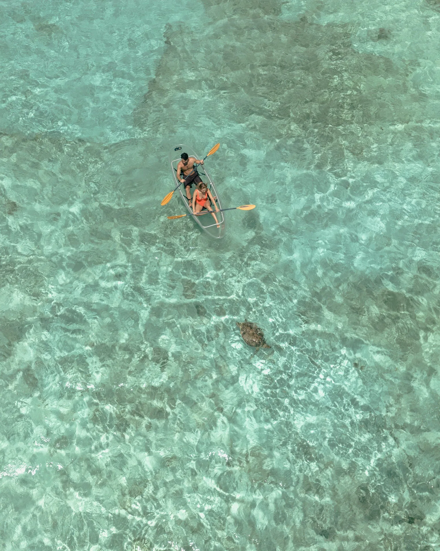 Clear kayak paddling over turquoise water at Rosewood Le Guanahani St Barth.