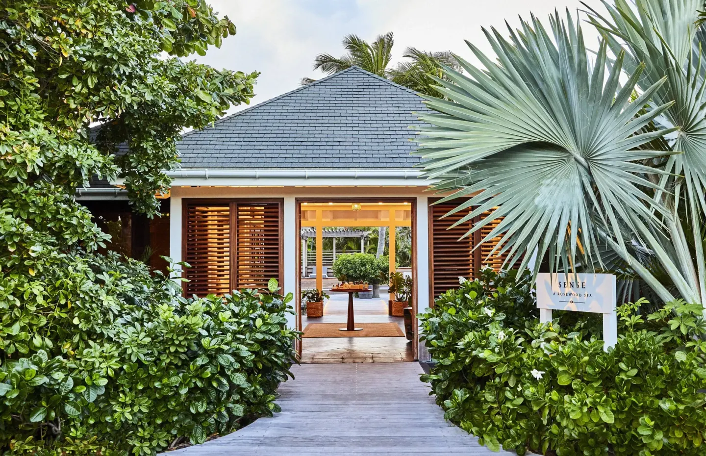 Spa entrance path surrounded by tropical plants at Rosewood Le Guanahani St Barth.