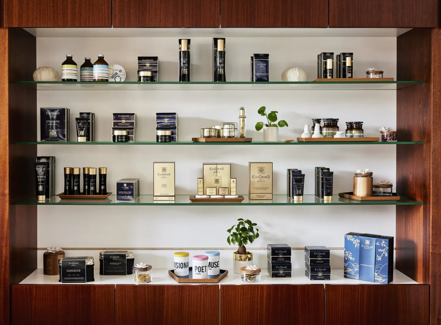 Spa product shelves with boxed and bottled skincare at Rosewood Le Guanahani St Barth.