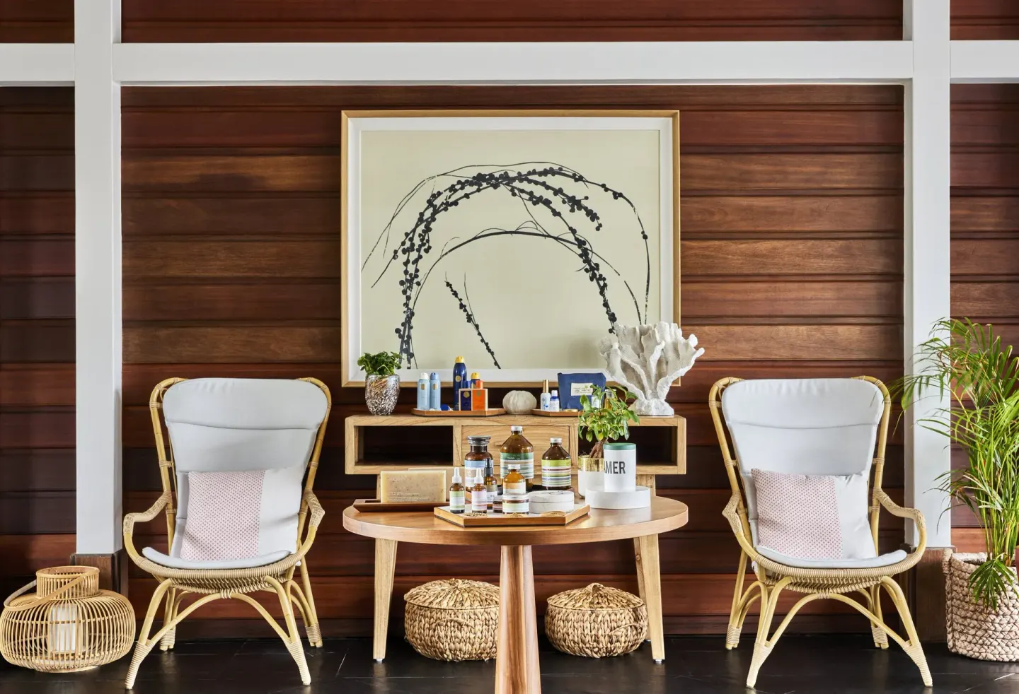 Spa retail display with rattan chairs at Rosewood Le Guanahani St Barth.