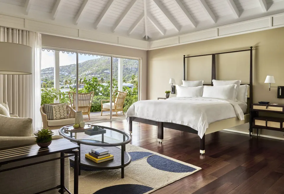 Admiral Suite king bedroom and sitting area at Rosewood Le Guanahani St Barth.