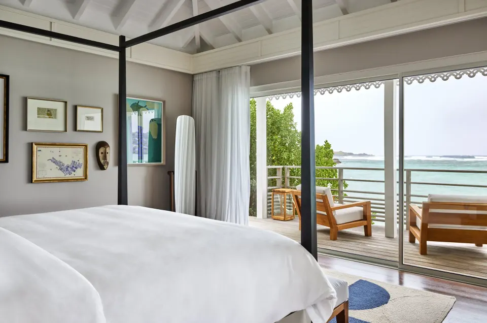 Admiral Suite bedroom with terrace and ocean view at Rosewood Le Guanahani St Barth.