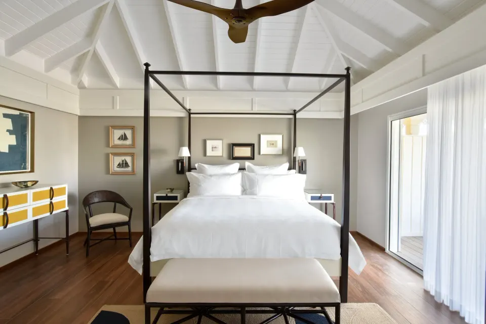 Beach Pool Suite bedroom with canopy king bed at Rosewood Le Guanahani St Barth.