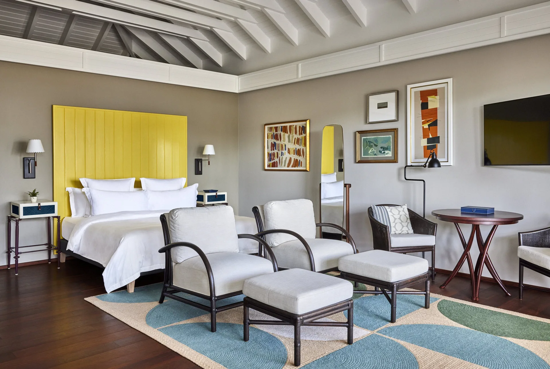 Beach Room king bed and sitting area at Rosewood Le Guanahani St Barth.