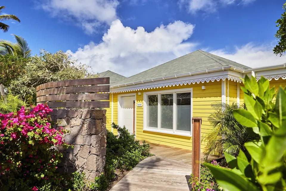 Bougainvillea Suite yellow exterior and garden at Rosewood Le Guanahani St Barth.