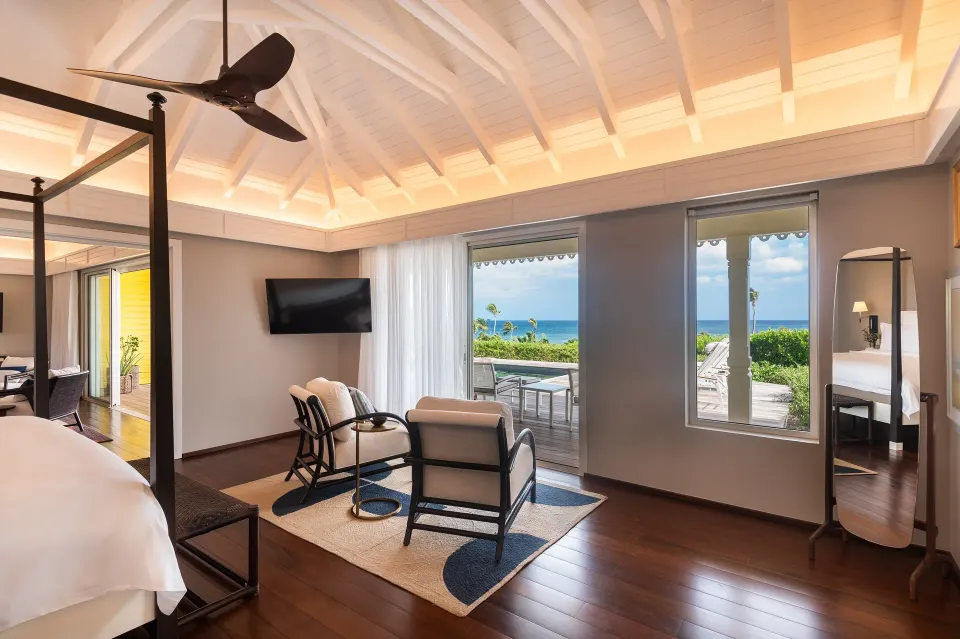 Bougainvillea Suite bedroom sitting area and ocean view at Rosewood Le Guanahani St Barth.