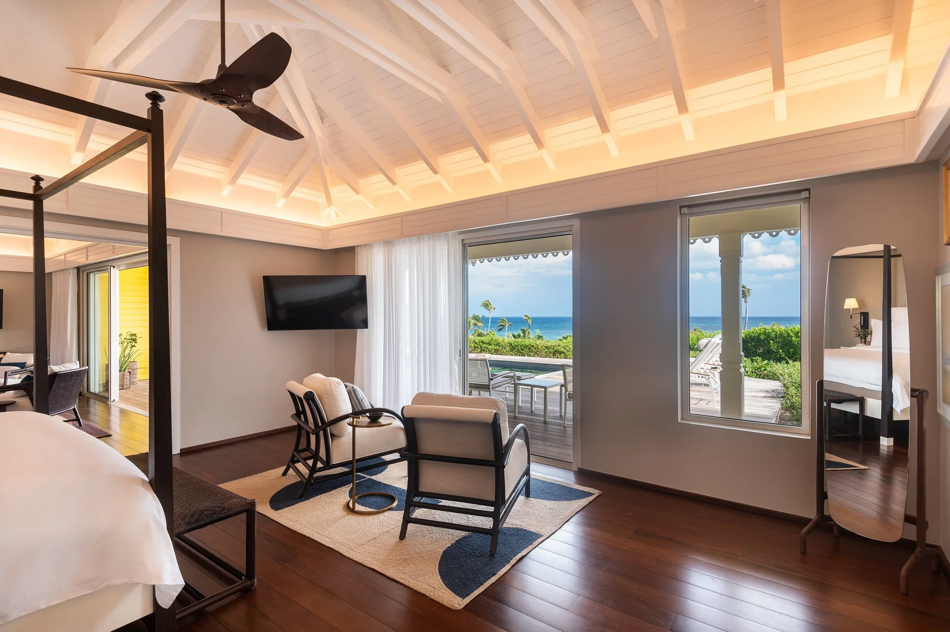 Bougainvillea Suite bedroom sitting area and ocean view at Rosewood Le Guanahani St Barth.
