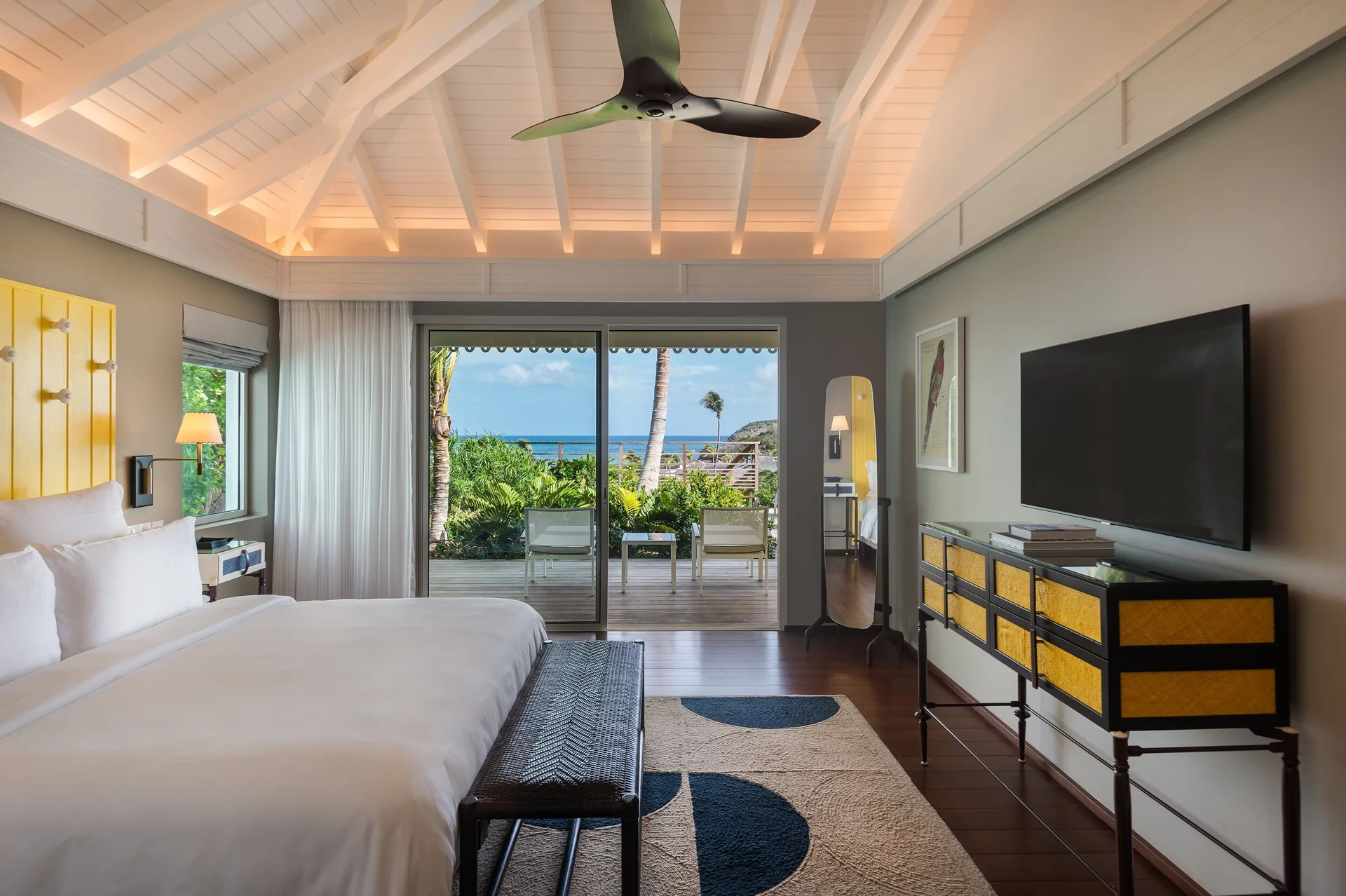 Bougainvillea Suite king bedroom with ocean-facing terrace at Rosewood Le Guanahani St Barth.