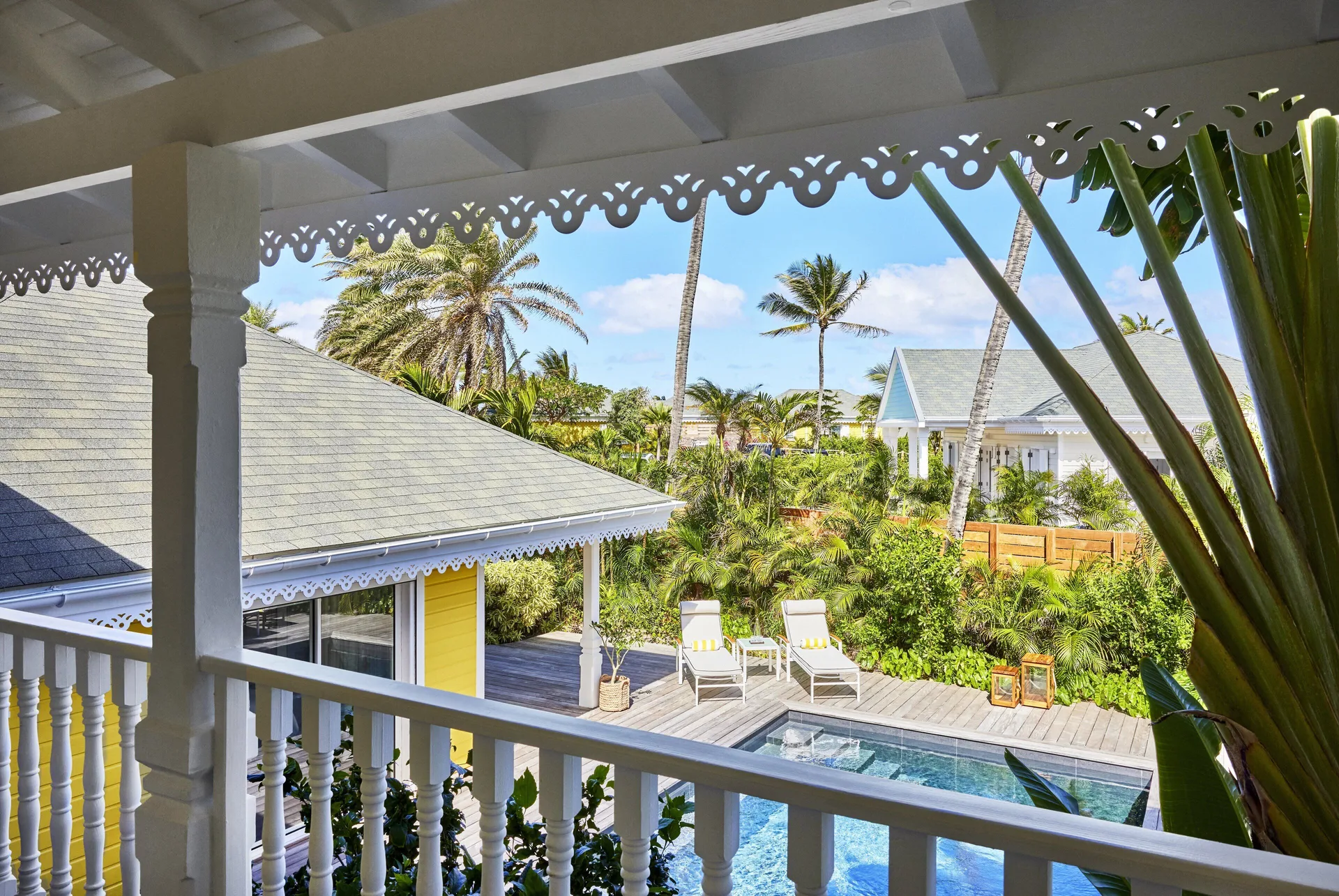 Garden House balcony view over the pool and palms at Rosewood Le Guanahani St Barth.