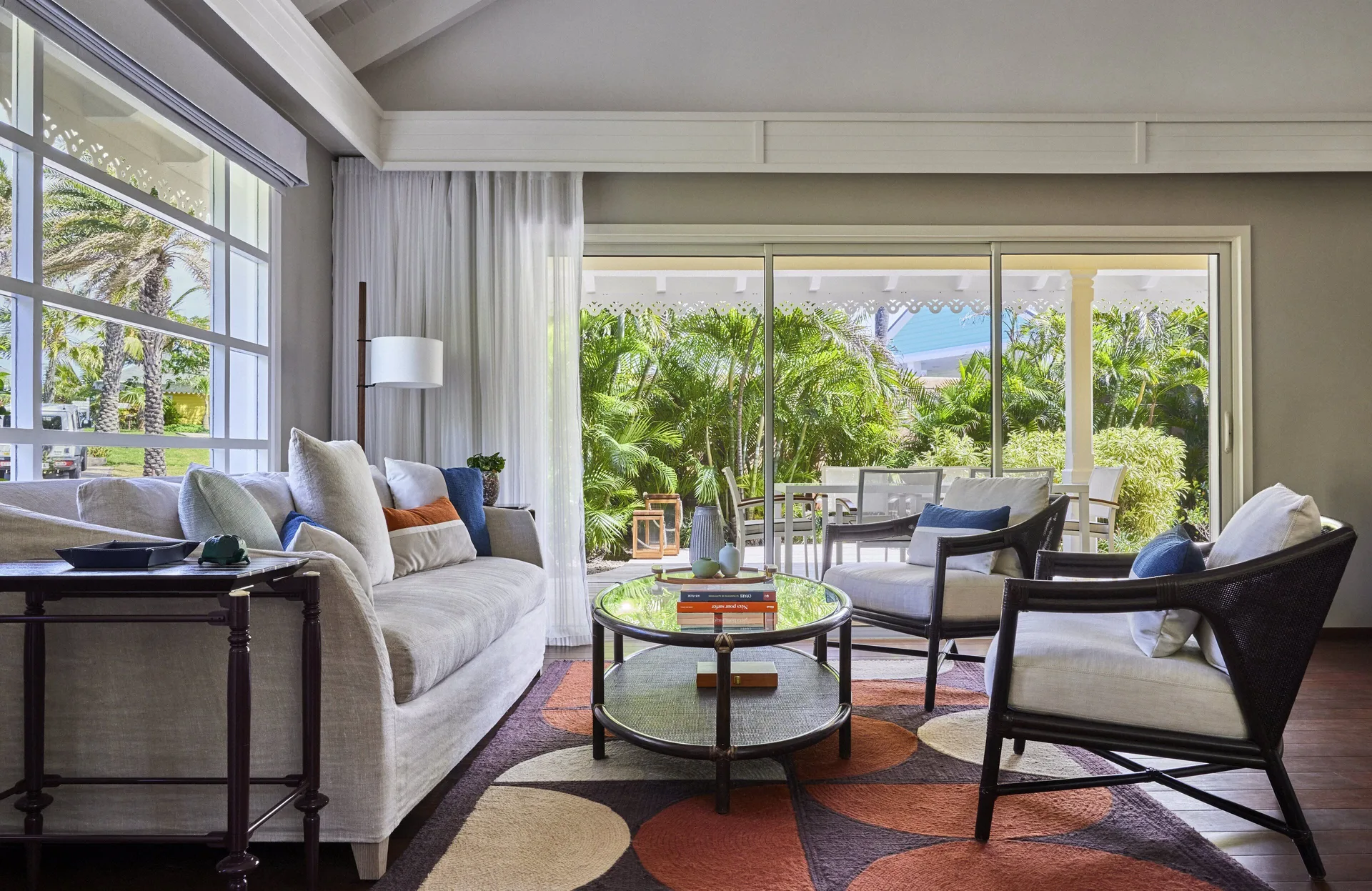 Garden House living room with sofa and terrace view at Rosewood Le Guanahani St Barth.