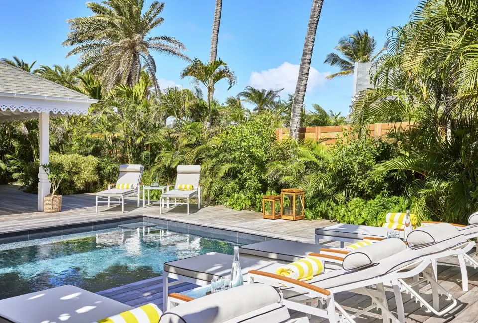 Garden House pool with loungers and tropical plants at Rosewood Le Guanahani St Barth.