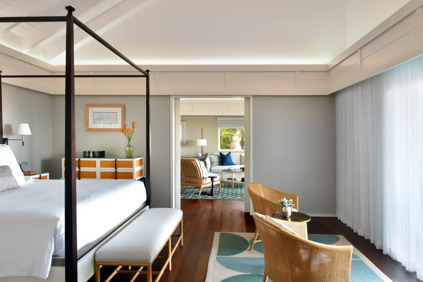Garden Suite bedroom with four-poster bed and sheer curtains at Rosewood Le Guanahani St Barth.