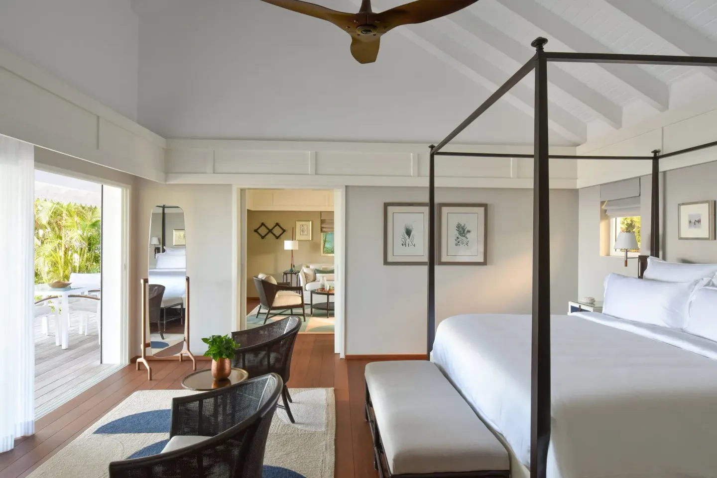 Garden Suite bedroom with four-poster bed and terrace doors at Rosewood Le Guanahani St Barth.