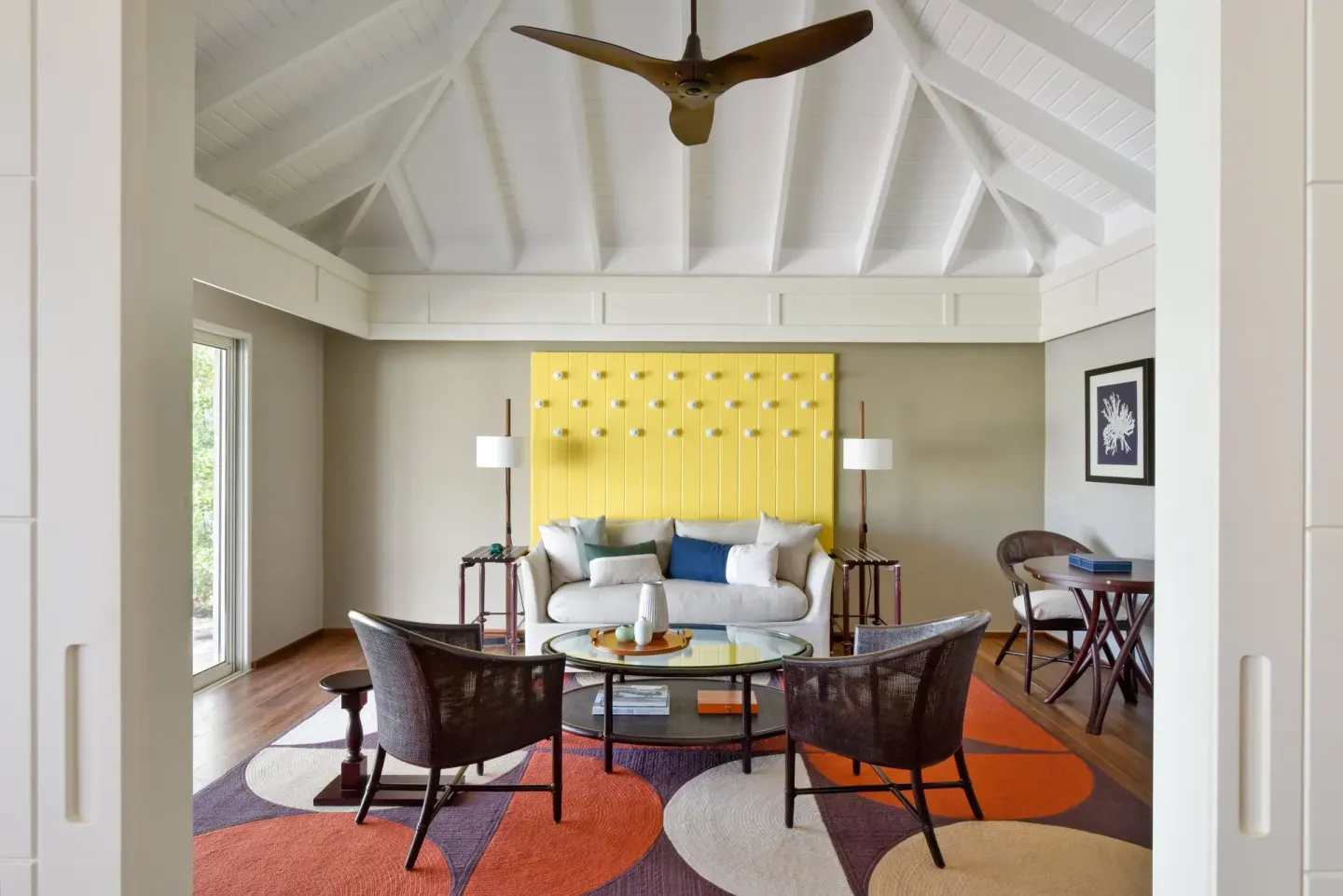 Garden Suite living room with sofa and vaulted ceiling at Rosewood Le Guanahani St Barth.