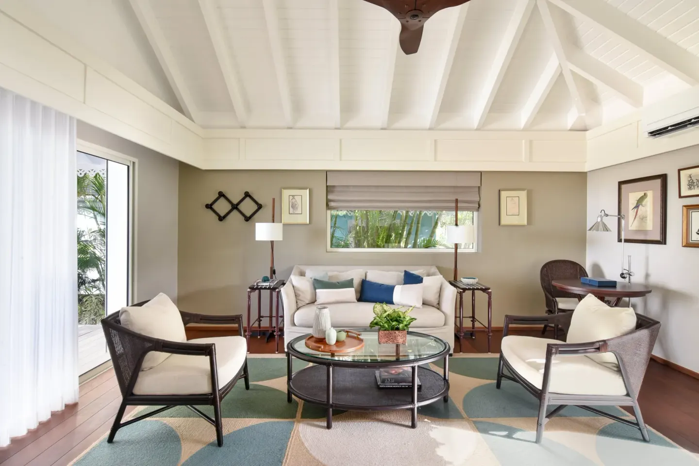 Garden Suite lounge with sofa and garden-facing windows at Rosewood Le Guanahani St Barth.