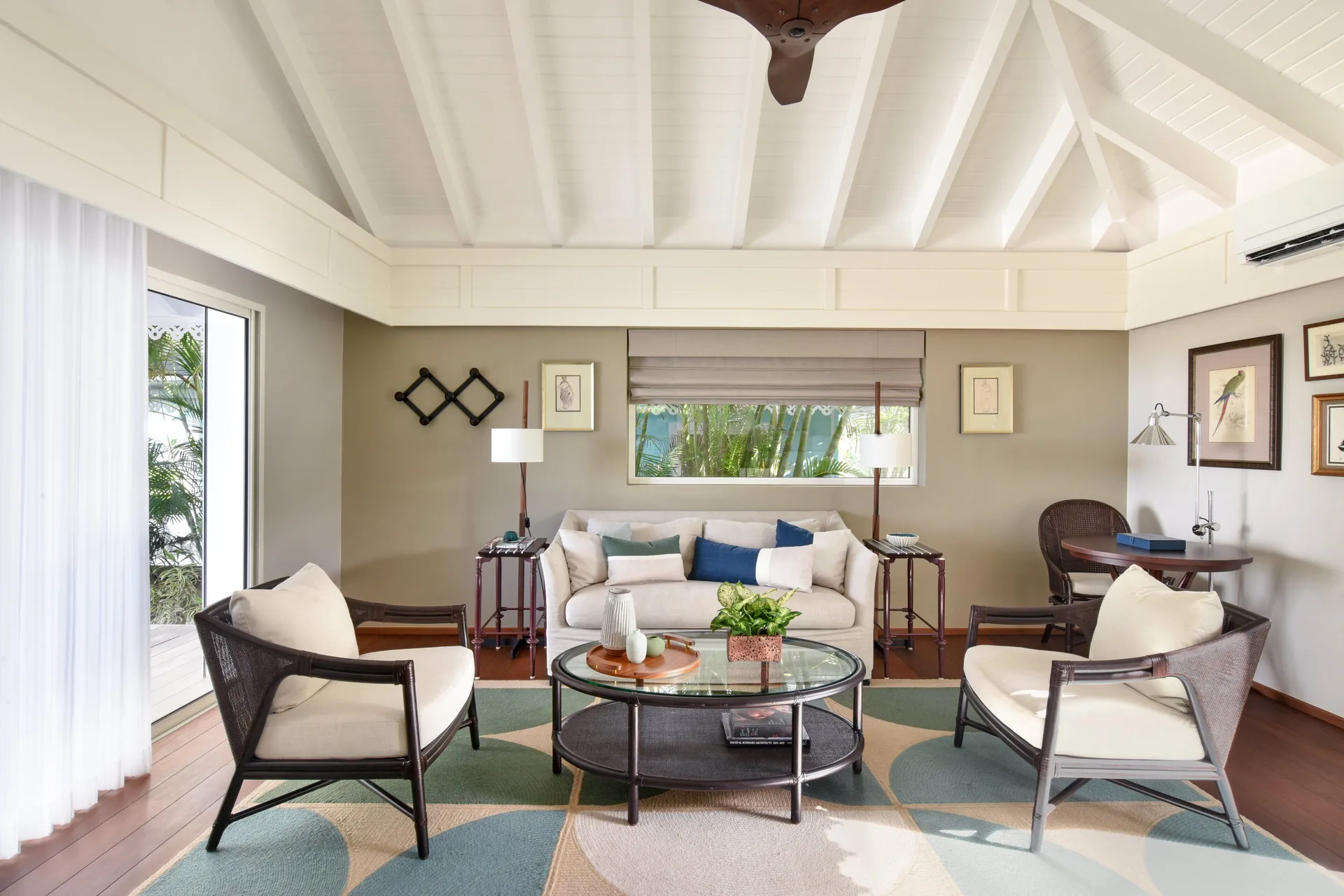 Garden Suite lounge with sofa and garden-facing windows at Rosewood Le Guanahani St Barth.