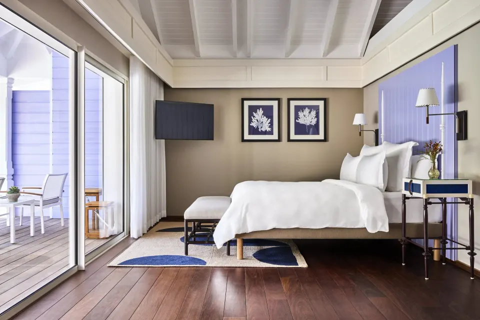 Hibiscus Suite king bed with terrace access at Rosewood Le Guanahani St Barth.
