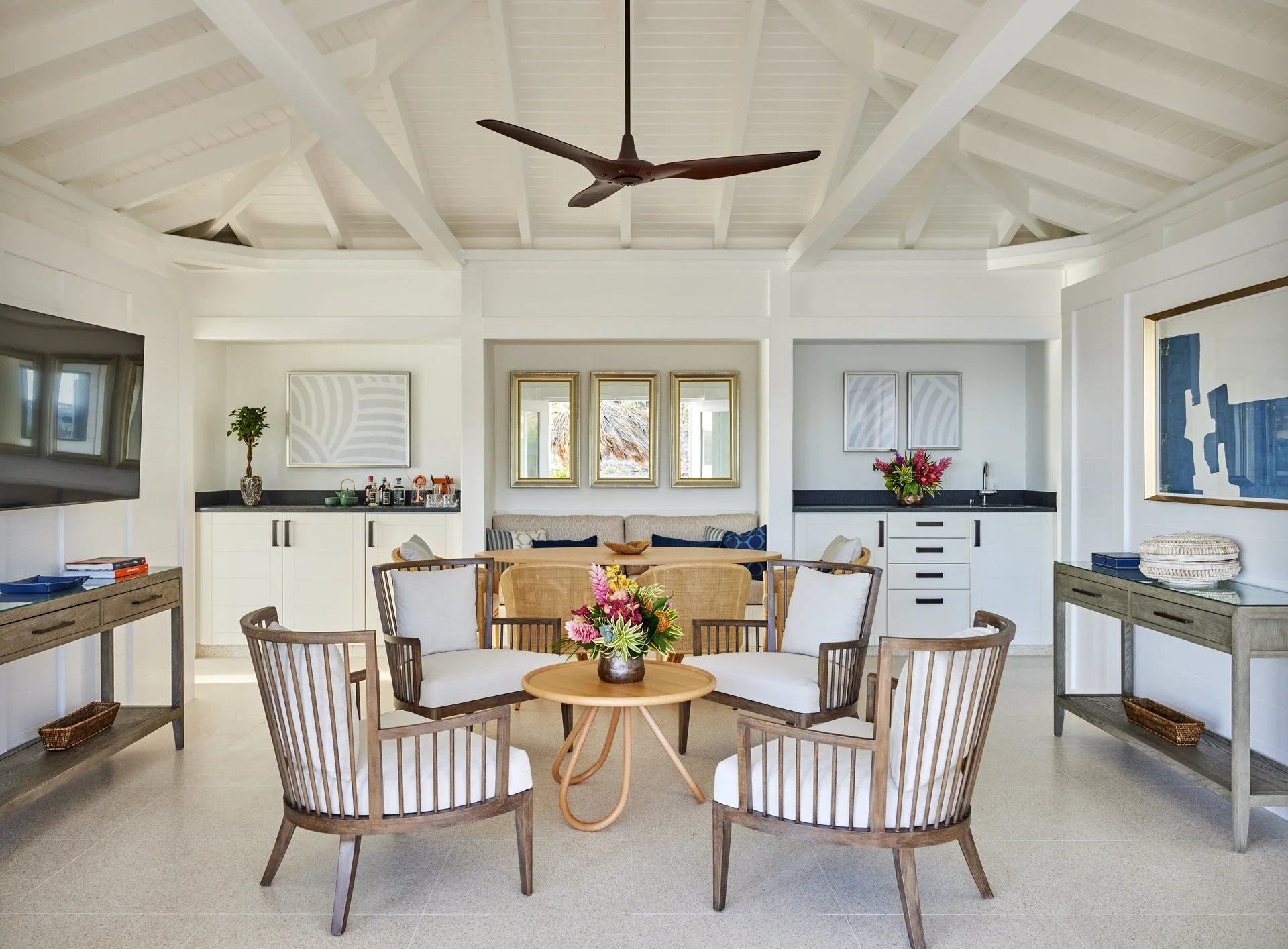Lagoon Suite living area with seating, kitchenette, and vaulted ceiling at Rosewood Le Guanahani St Barth.