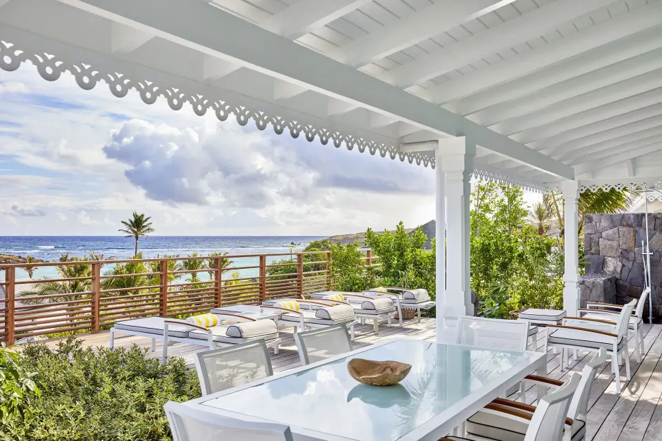 Marechal Suite covered terrace with dining table at Rosewood Le Guanahani St Barth.
