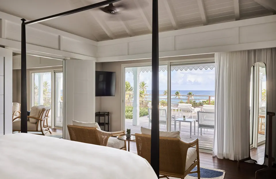 Marechal Suite bedroom with terrace and ocean view at Rosewood Le Guanahani St Barth.