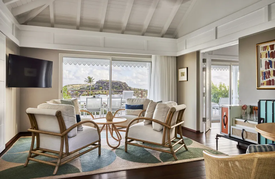 Marechal Suite living room with terrace doors at Rosewood Le Guanahani St Barth.