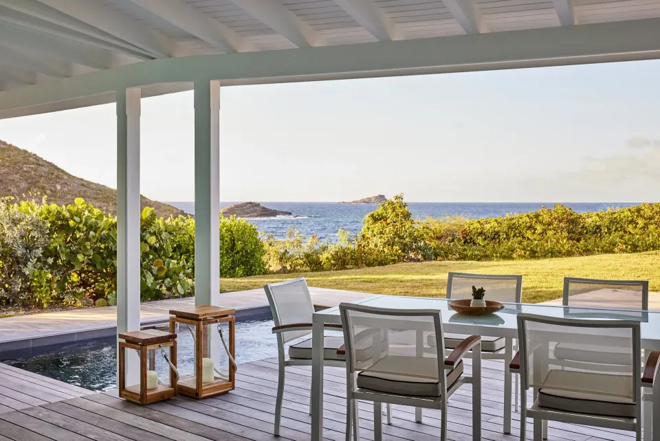 Marigot Suite covered terrace with pool and sea view at Rosewood Le Guanahani St Barth.