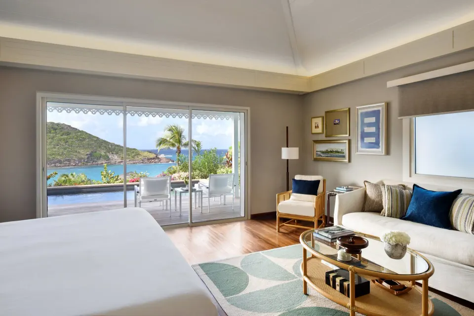 Ocean Bay Pool Room with bed, sitting area, terrace and sea view at Rosewood Le Guanahani St Barth.