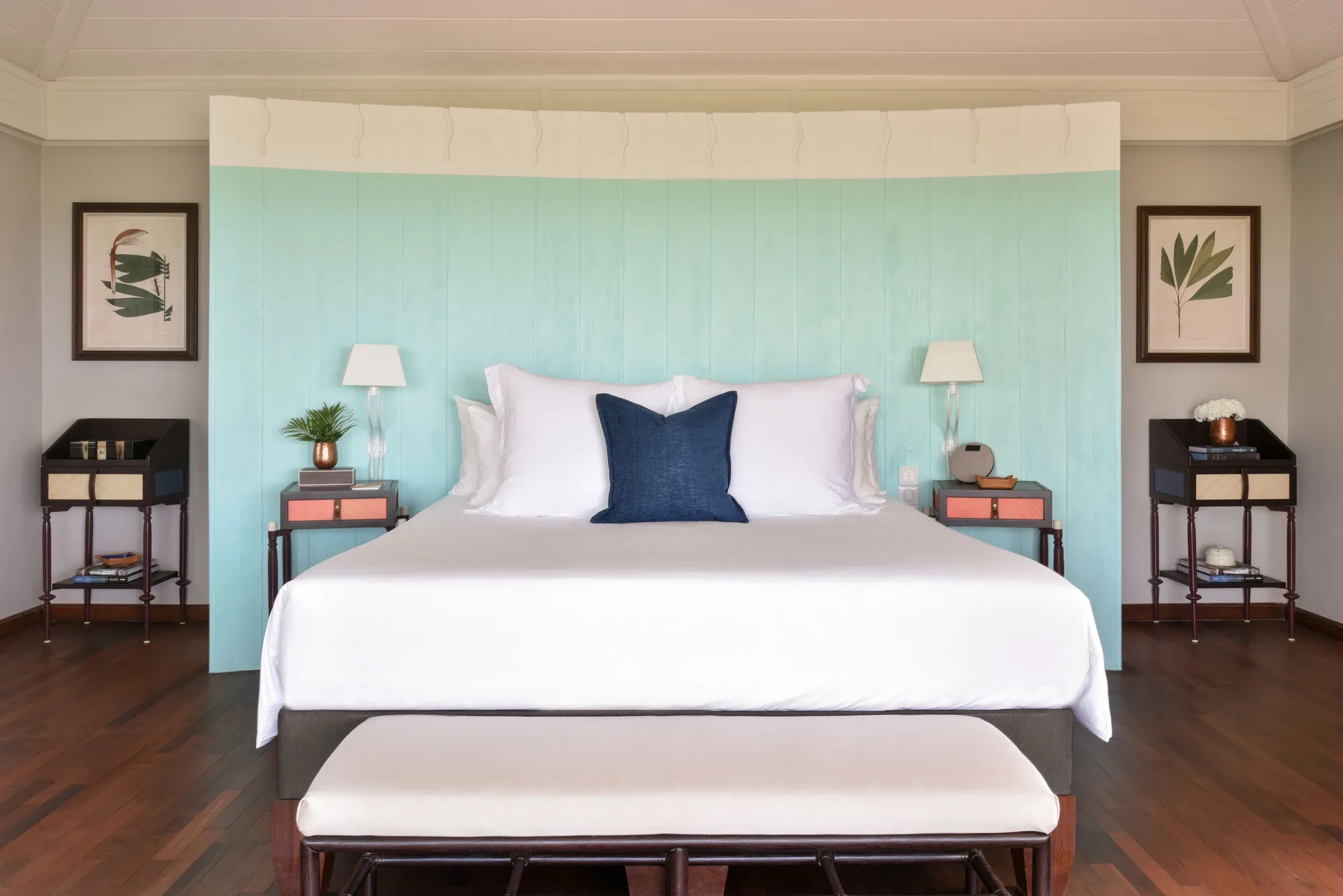Ocean Bay Room king bed with aqua headboard at Rosewood Le Guanahani St Barth.