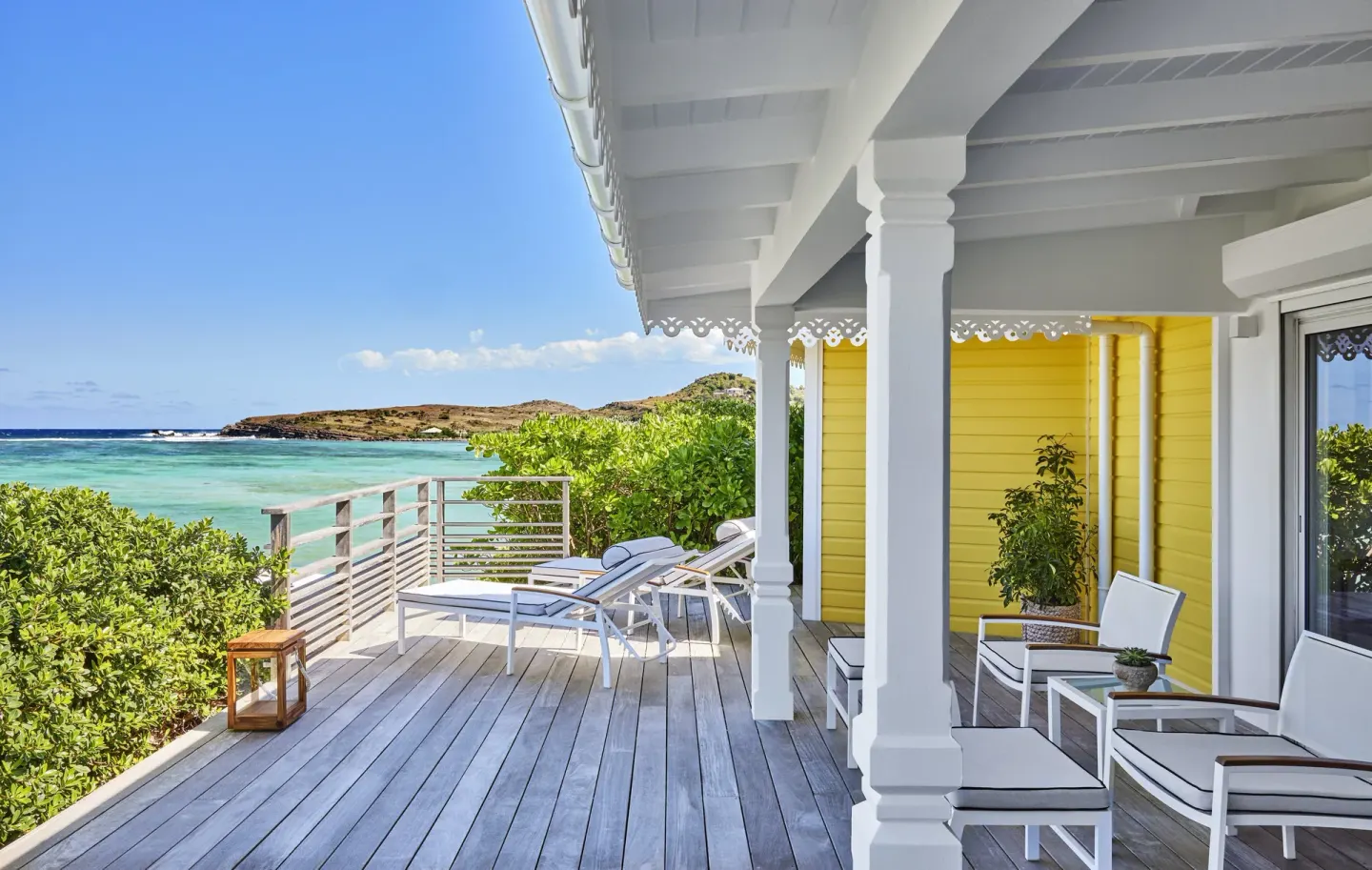 Ocean Cove Junior Suite terrace with loungers and ocean view at Rosewood Le Guanahani St Barth.
