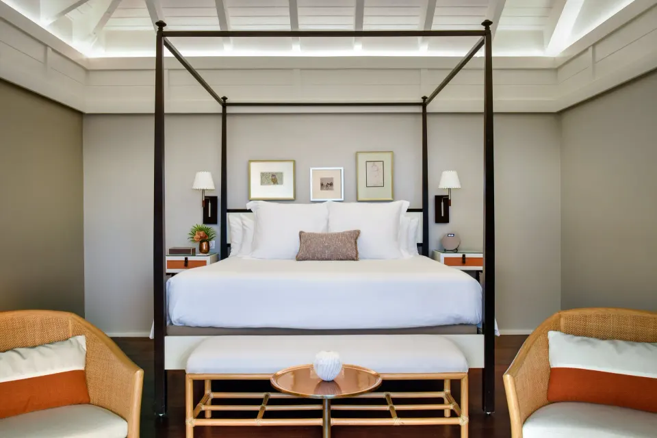 Ocean View Suite king bed with canopy frame at Rosewood Le Guanahani St Barth.