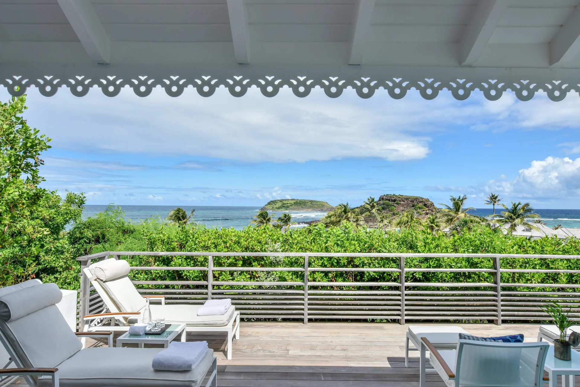 Ocean View Suite terrace with loungers and sea view at Rosewood Le Guanahani St Barth.