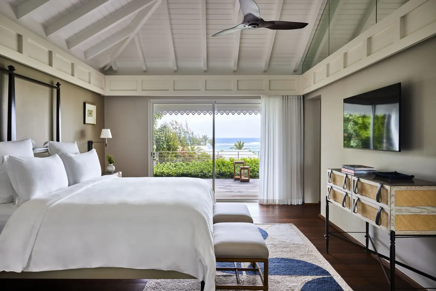Serenity Suite bedroom with ocean-facing terrace at Rosewood Le Guanahani St Barth.