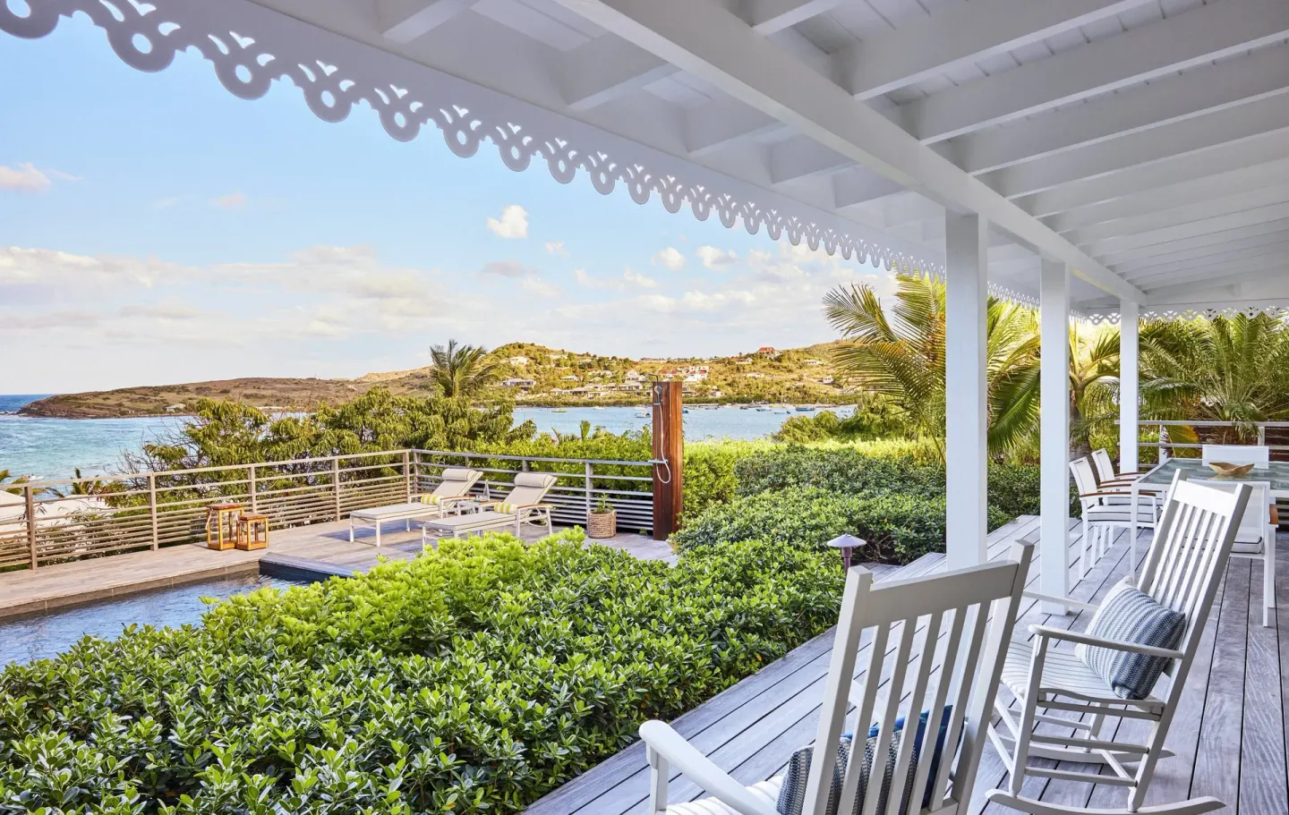 Serenity Suite covered terrace with pool and bay view at Rosewood Le Guanahani St Barth.