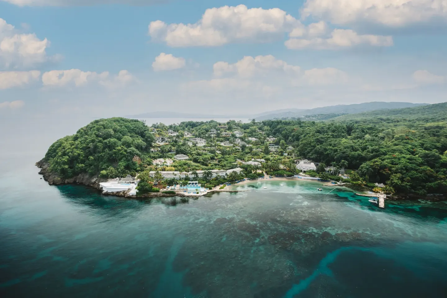Aerial view of the coastline and resort grounds at Round Hill Hotel And Villas.