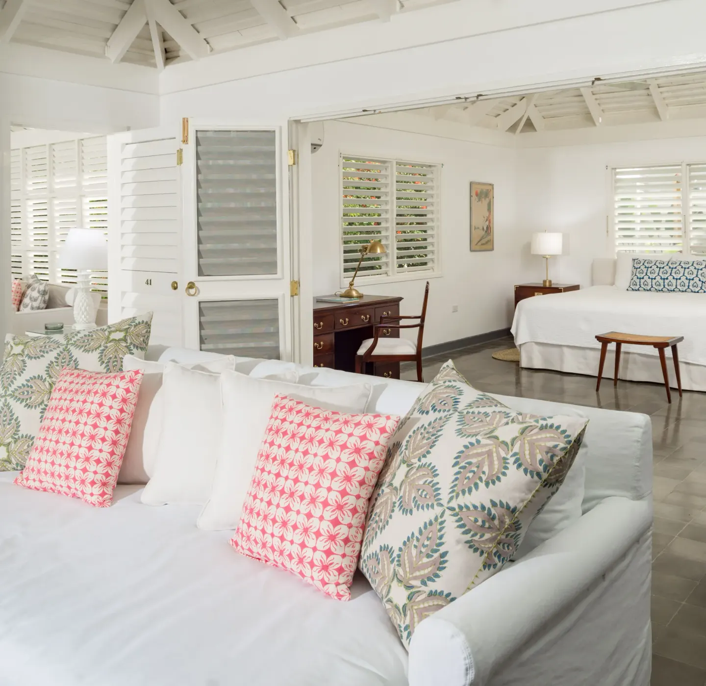 Villa living room and bedroom doorway at Round Hill Hotel And Villas.